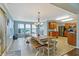 Bright breakfast nook with large wooden table and plenty of windows for natural light at 3221 Holt St, Whiteland, IN 46184