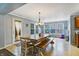 Open breakfast nook and dining area with natural light, a modern light fixture, and a patio door at 3221 Holt St, Whiteland, IN 46184