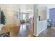 Inviting entryway leading to a playroom and living area, with hardwood floors at 3221 Holt St, Whiteland, IN 46184