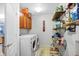 Laundry room featuring shelving with stored items and a side-by-side washer and dryer set at 3221 Holt St, Whiteland, IN 46184