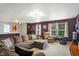 Spacious living room with a large sectional sofa, reclining chair, and a projector screen at 3221 Holt St, Whiteland, IN 46184