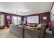 Cozy living room with a projector screen, comfortable sofa, and a warm, inviting atmosphere at 3221 Holt St, Whiteland, IN 46184
