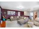 Spacious living room with large sectional sofa and projector, perfect for entertaining guests at 3221 Holt St, Whiteland, IN 46184