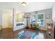 Bright playroom with a basketball hoop, colorful storage bins, and a play mat at 3221 Holt St, Whiteland, IN 46184