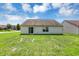 Well-maintained backyard featuring a sliding glass door, and well kept lawn at 3222 Enclave Ln, Greenwood, IN 46143