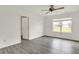 Bright bedroom with large window and modern gray flooring at 3222 Enclave Ln, Greenwood, IN 46143