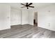 Spacious bedroom featuring modern gray flooring and ample natural light at 3222 Enclave Ln, Greenwood, IN 46143
