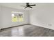 Bedroom featuring a window for natural light and modern gray flooring at 3222 Enclave Ln, Greenwood, IN 46143