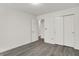 Inviting bedroom showcasing contemporary gray vinyl flooring and a closet, enhancing the room's appeal at 3222 Enclave Ln, Greenwood, IN 46143