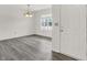 Bright entryway with gray wood floors, white walls, and natural light at 3222 Enclave Ln, Greenwood, IN 46143