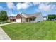 Single-Gathering home with attached garage, manicured lawn, and blue sky at 3222 Enclave Ln, Greenwood, IN 46143