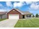 Charming single-Gathering home with brick facade, attached garage, and well-maintained lawn at 3222 Enclave Ln, Greenwood, IN 46143