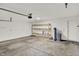 Spacious garage with concrete flooring, shelves, and access to utilities at 3222 Enclave Ln, Greenwood, IN 46143