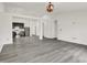 Open-concept living area flowing into kitchen with stainless steel appliances at 3222 Enclave Ln, Greenwood, IN 46143