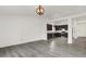 Spacious living room featuring gray flooring and seamlessly connected to a modern kitchen at 3222 Enclave Ln, Greenwood, IN 46143