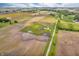 Expansive aerial view of a house and surrounding fields, showcasing the serene countryside location at 3319 E 700 N, Whiteland, IN 46184