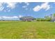 Spacious backyard featuring a well-maintained lawn, deck, hot tub, and a charming shed, perfect for outdoor enjoyment at 3319 E 700 N, Whiteland, IN 46184