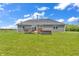 A great backyard with a wooden deck, hot tub, and manicured lawn, ideal for relaxation and outdoor gatherings at 3319 E 700 N, Whiteland, IN 46184