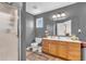 Full bathroom with frosted glass enclosed shower, vanity with sink, and natural light from a window at 3319 E 700 N, Whiteland, IN 46184