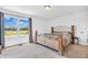 Well-lit bedroom with large window overlooking the water and landscape, creating a relaxing ambiance at 3319 E 700 N, Whiteland, IN 46184