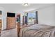 Spacious bedroom with natural light, walk-in closet, and view of the water and landscape at 3319 E 700 N, Whiteland, IN 46184