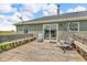 Back deck with comfortable seating area, providing a relaxing space to enjoy the outdoor view at 3319 E 700 N, Whiteland, IN 46184