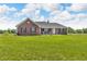 Charming brick home with a well-manicured lawn and inviting front porch at 3319 E 700 N, Whiteland, IN 46184