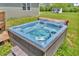 Inviting hot tub with steps, set in a beautifully maintained yard, with a small shed nearby at 3319 E 700 N, Whiteland, IN 46184