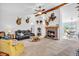 Cozy living room with a brick fireplace, ceiling fan, and comfortable seating at 3319 E 700 N, Whiteland, IN 46184