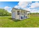 Outdoor shed with a garage door and porch, perfect for storage or a workshop at 3319 E 700 N, Whiteland, IN 46184