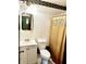 The bathroom has a toilet, sink, medicine cabinet, and a shower with curtain at 3633 Tiffany Dr, Indianapolis, IN 46226