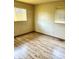 Bright bedroom features a window and beautiful wood flooring at 3633 Tiffany Dr, Indianapolis, IN 46226