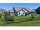 Spacious backyard featuring lush green lawn, privacy fence, and plenty of space for outdoor activities at 3691 Talmine Ln, Bargersville, IN 46106