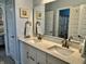 Elegant bathroom with double vanity sinks, modern fixtures, and attractive wall decor at 3691 Talmine Ln, Bargersville, IN 46106
