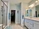 Bright bathroom featuring a glass shower, double vanity, and a spacious walk-in closet at 3691 Talmine Ln, Bargersville, IN 46106