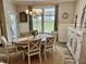 A dining room featuring an elegant chandelier, dining table set, and an ornate sideboard at 3691 Talmine Ln, Bargersville, IN 46106