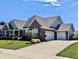 Charming brick home with a three-car garage and manicured front lawn at 3691 Talmine Ln, Bargersville, IN 46106