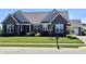 Beautiful brick home with a manicured lawn, complemented by lush landscaping and a welcoming entrance at 3691 Talmine Ln, Bargersville, IN 46106