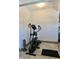 Home garage area with an elliptical fitness machine and heater at 3691 Talmine Ln, Bargersville, IN 46106