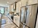 Well-appointed kitchen features stainless steel appliances and white cabinets with open layout at 3691 Talmine Ln, Bargersville, IN 46106