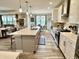 A spacious kitchen featuring an island, modern stainless appliances, and stylish pendant lighting at 3691 Talmine Ln, Bargersville, IN 46106