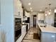 Gourmet kitchen featuring stainless steel appliances, white cabinets, and large center island with seating at 3691 Talmine Ln, Bargersville, IN 46106