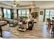 A spacious living room with a ceiling fan, large windows, and stylishly arranged furniture at 3691 Talmine Ln, Bargersville, IN 46106