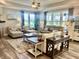 A well-lit living room featuring comfortable seating and large windows offering scenic views at 3691 Talmine Ln, Bargersville, IN 46106