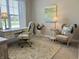 Bright home office with a comfortable desk, chair, and a calming view from the window at 3691 Talmine Ln, Bargersville, IN 46106