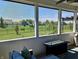 Relaxing screened porch with comfortable seating and a view of the community at 3691 Talmine Ln, Bargersville, IN 46106