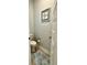 Cozy powder room with tile floors, toilet, and framed art on the wall at 3691 Talmine Ln, Bargersville, IN 46106