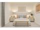 Elegant bedroom with neutral tones, a plush bed, stylish nightstands, and a comfortable bench at the foot of the bed at 3882 Andean Ct, Bargersville, IN 46106