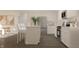 Modern kitchen with sleek, white cabinets, stainless steel appliances, and a functional center island with barstool seating at 3882 Andean Ct, Bargersville, IN 46106