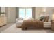 An inviting primary bedroom featuring large windows, neutral tones, sitting area, and stylish decor at 3882 Andean Ct, Bargersville, IN 46106